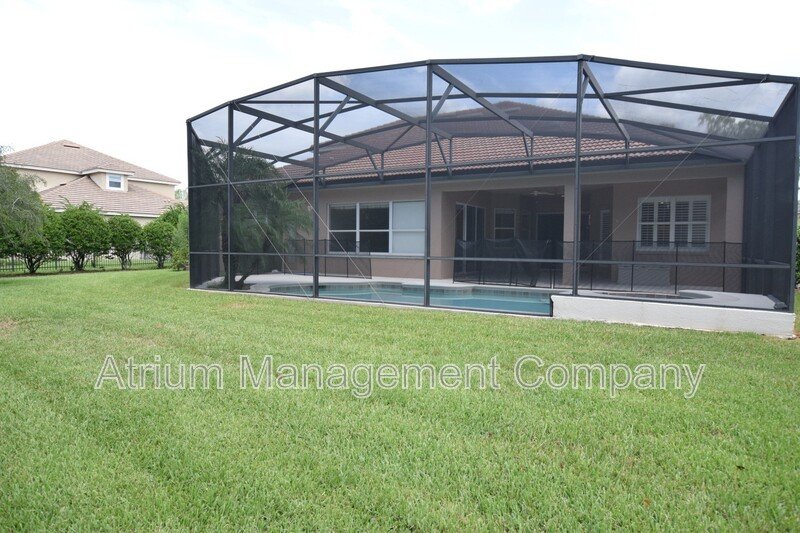 Spacious 4 Bed, 4 Bath + Bonus Room Gated Pool Home in Lake Mary, FL – Magnolia Plantation property image