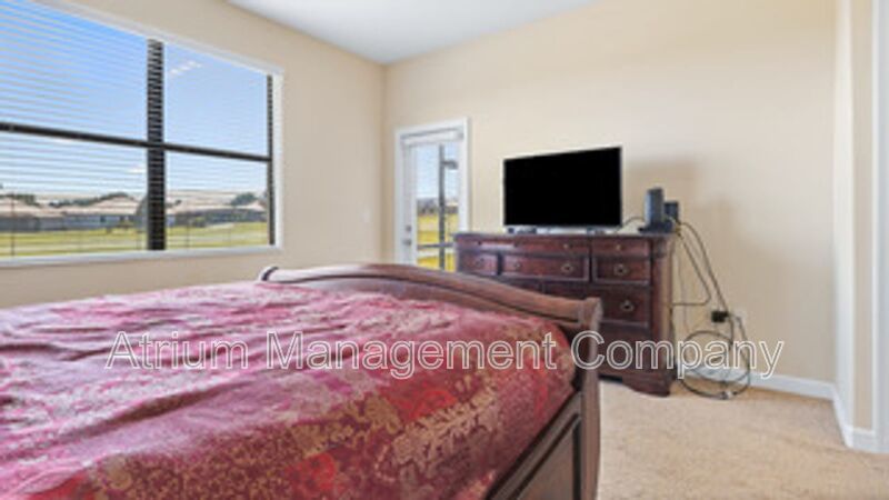 Luxury Golf Course Living in ChampionsGate: 2-Bedroom Condo at Champions Club property image