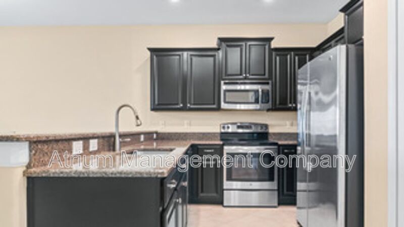 Luxury Golf Course Living in ChampionsGate: 2-Bedroom Condo at Champions Club property image